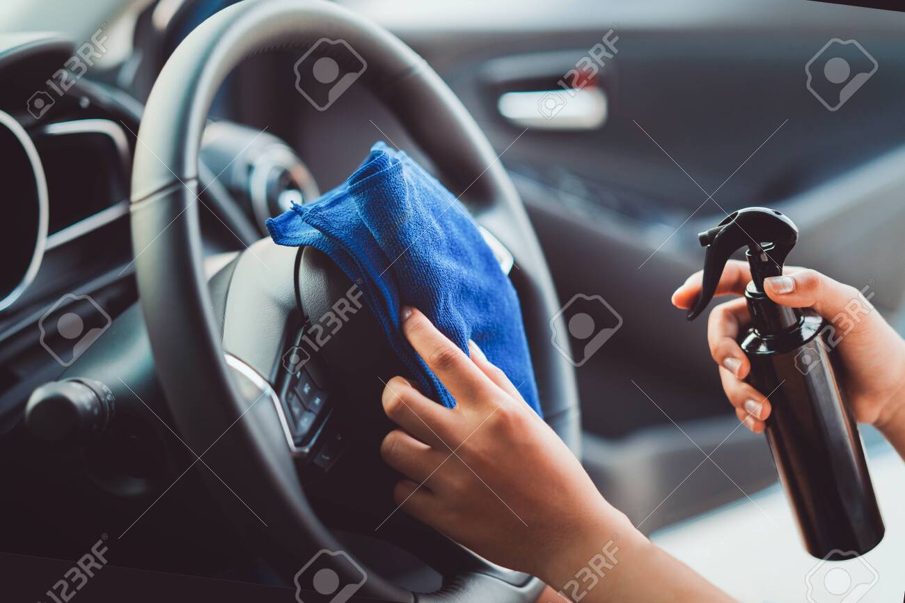 Steering Wheel Cleaner >> Professional Woman Cleaning Steering Wheel And Console Car Using Steering Wheel Cleaner >> Professional Woman Cleaning Steering Wheel And Console Car Using