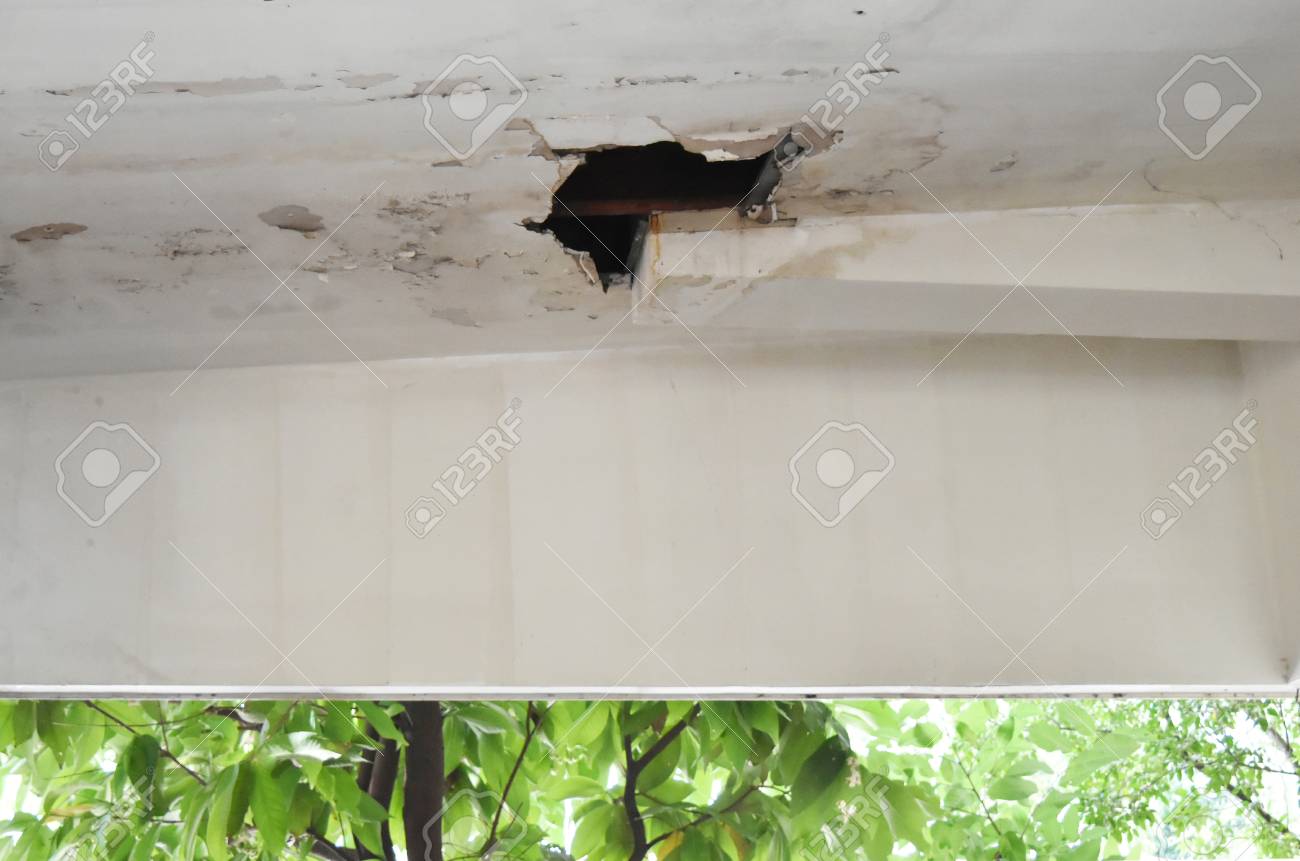 Rainwater Leaks From The Roof Cause Damage To The Ceiling And