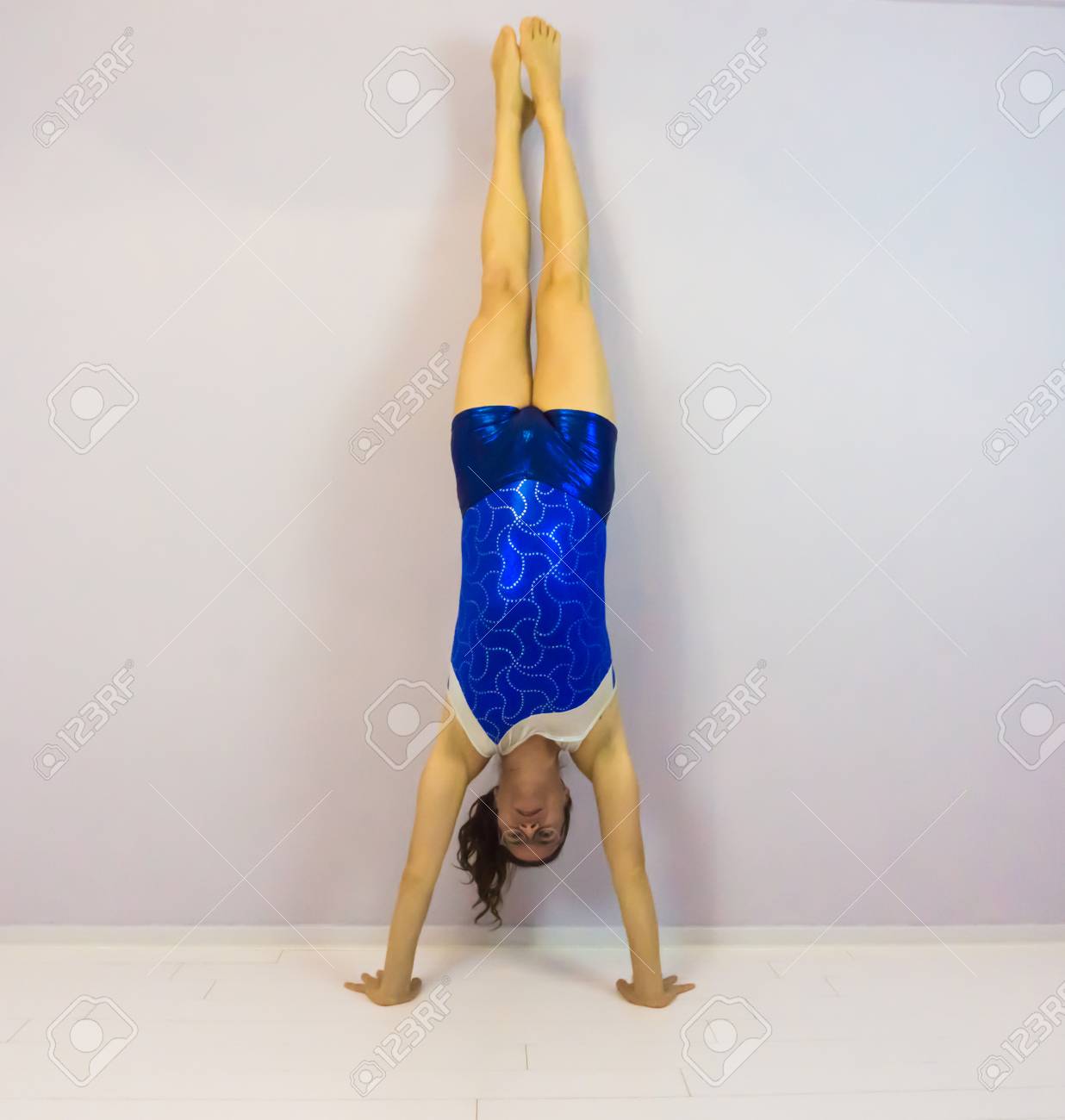 transgender child leotard Acrobatic Gymnastics Young Transgender Girl Standing On Her Hands In The Handstand And Wearing A Blue Shiny Leotard Stock Photo, Picture and Royalty Free Image. Image 112915914.