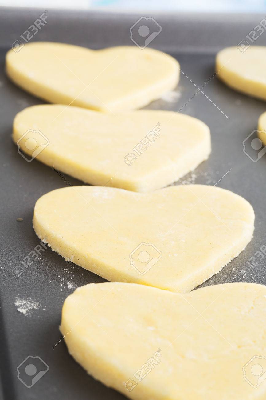 heart shaped cookies on baking sheet ready for baking stock photo heart shaped cookie sheet