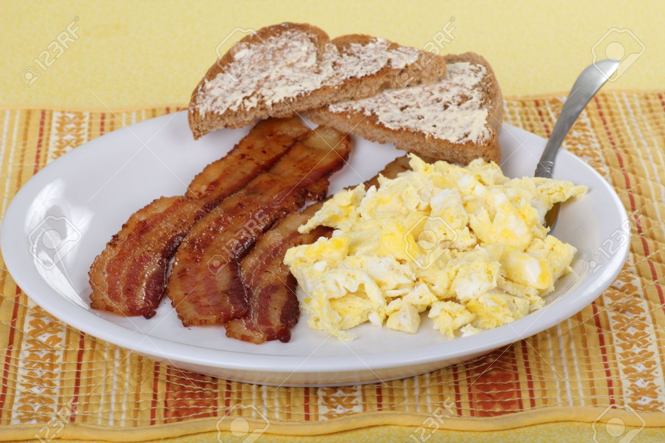 Bacon And Scrambled Egg Breakfast With Buttered Toast Stock Photo Picture And Royalty Free Image Image