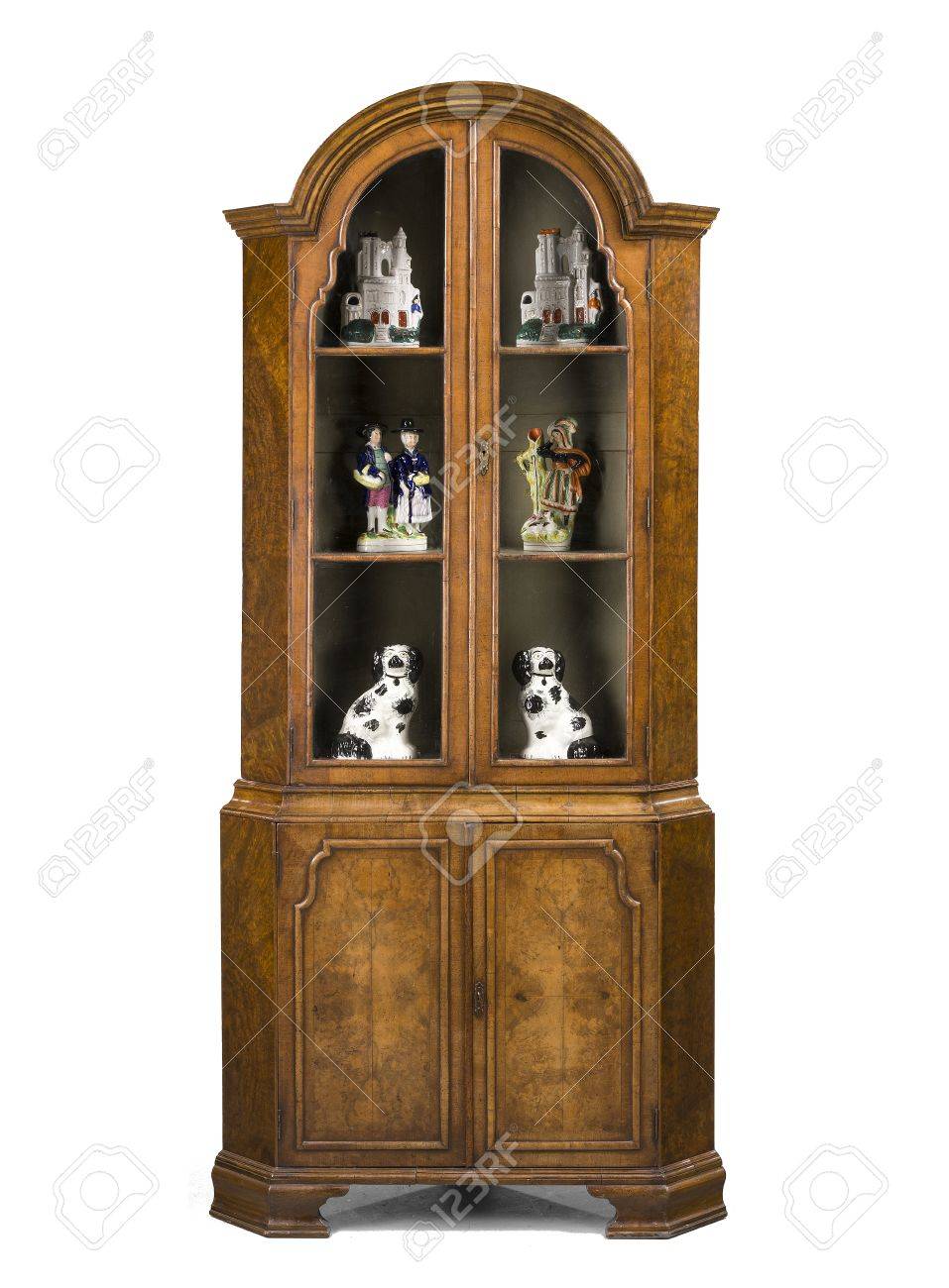 Old Antique Corner Cupboard In Walnut And In The Style Of Queen old antique corner cupboard in walnut and in the style of Queen Anne English isolated on - Old Antique Corner Cupboard In Walnut And In The Style Of Queen