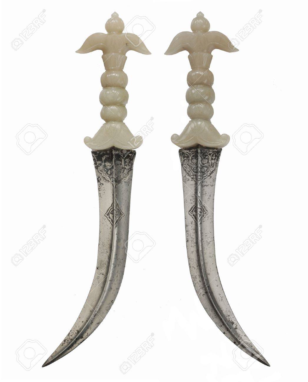 rare and unusual asian daggers with curved steel blade ivory stock asian pins
