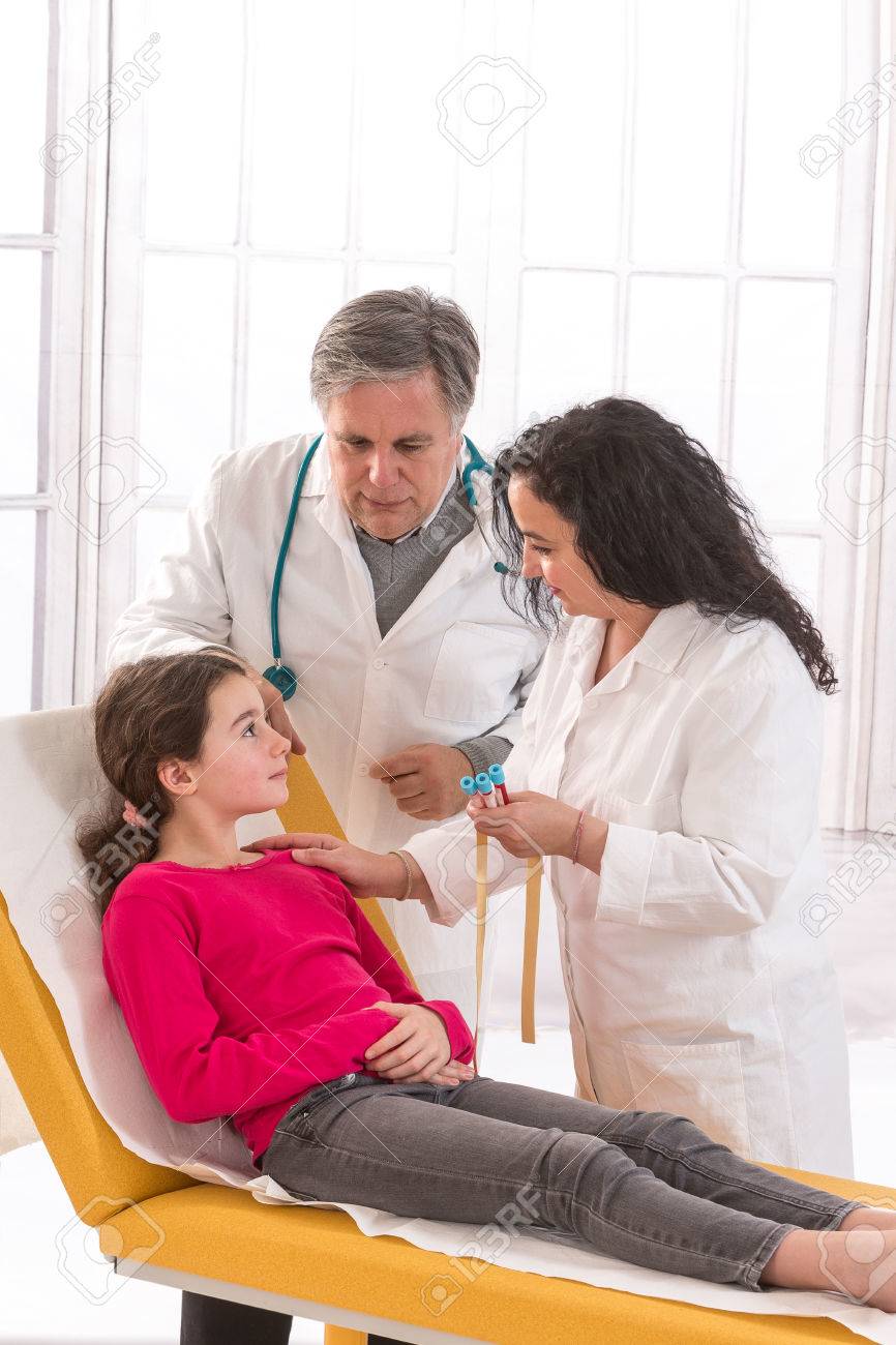 Doctor Examining Teen Girl Doctor Examining Teen Girl
