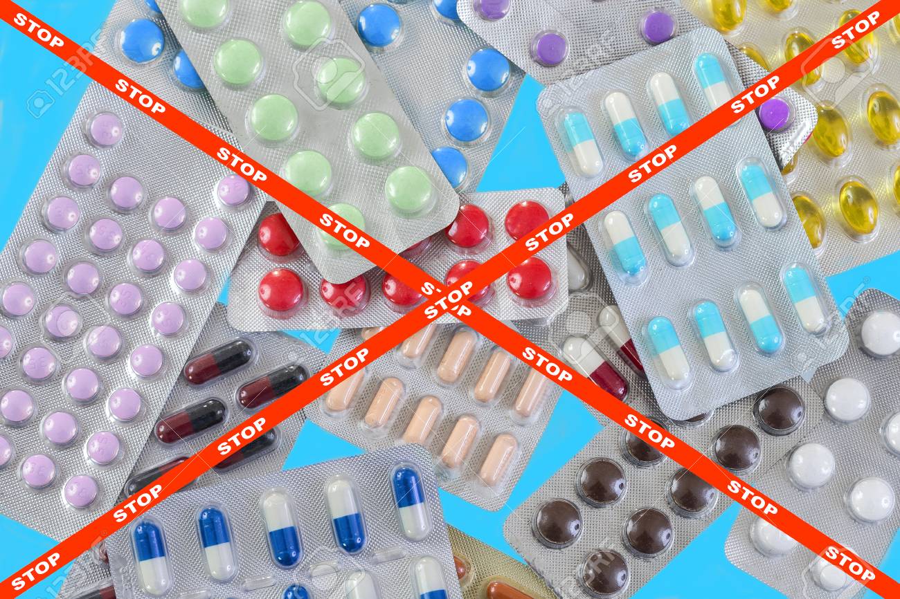 blisters of medical pills over blue background with stop crossed ribbon as a pharmaceutical industry concept danger - 94821830 blisters of medical pills over blue background with stop crossed ribbon as a pharmaceutical industry concept danger - 94821830
