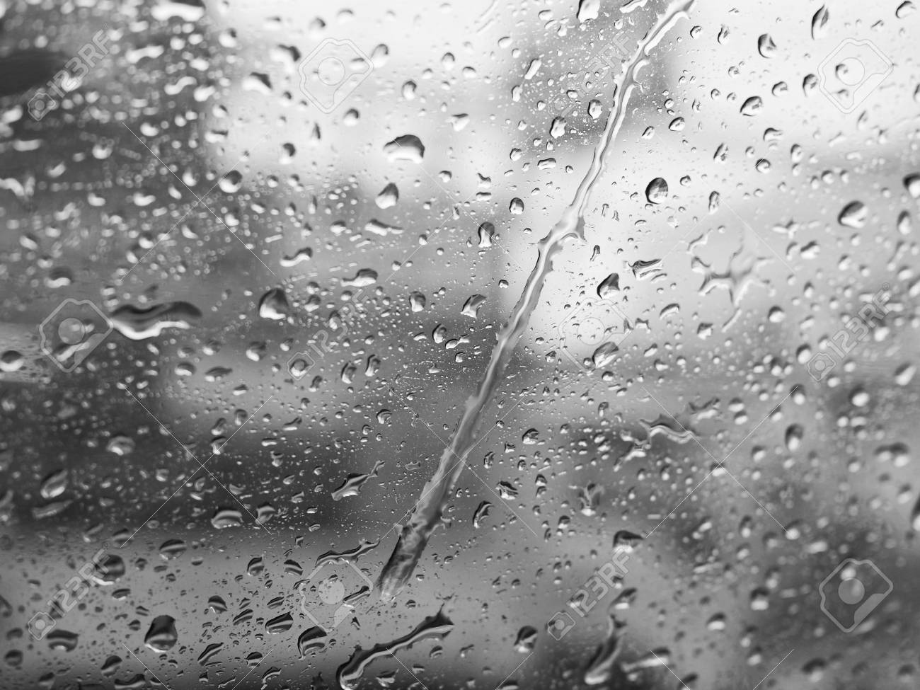 Rain on window black and white