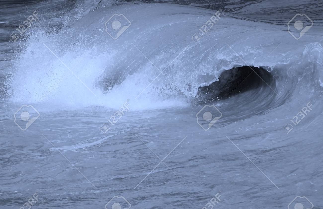 ocean surf wave barrell curling before crashing stock photo picture