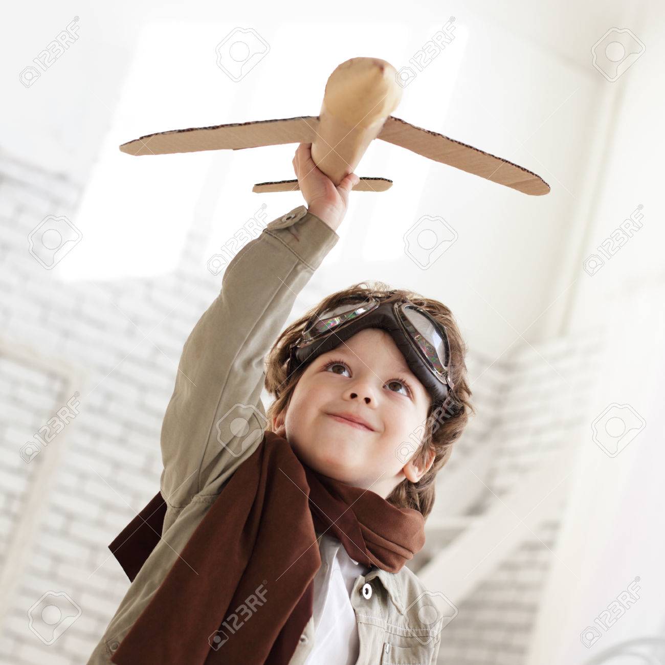 happy boy with airplane in hand - 26035359 happy boy with airplane in hand - 26035359