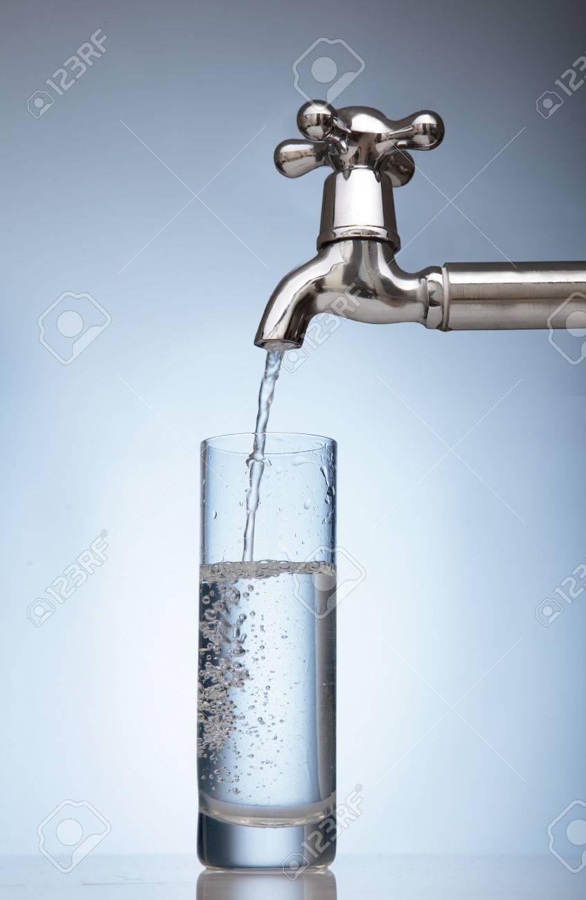 clean water is poured into a glass from the tap - 31960023 clean water is poured into a glass from the tap - 31960023