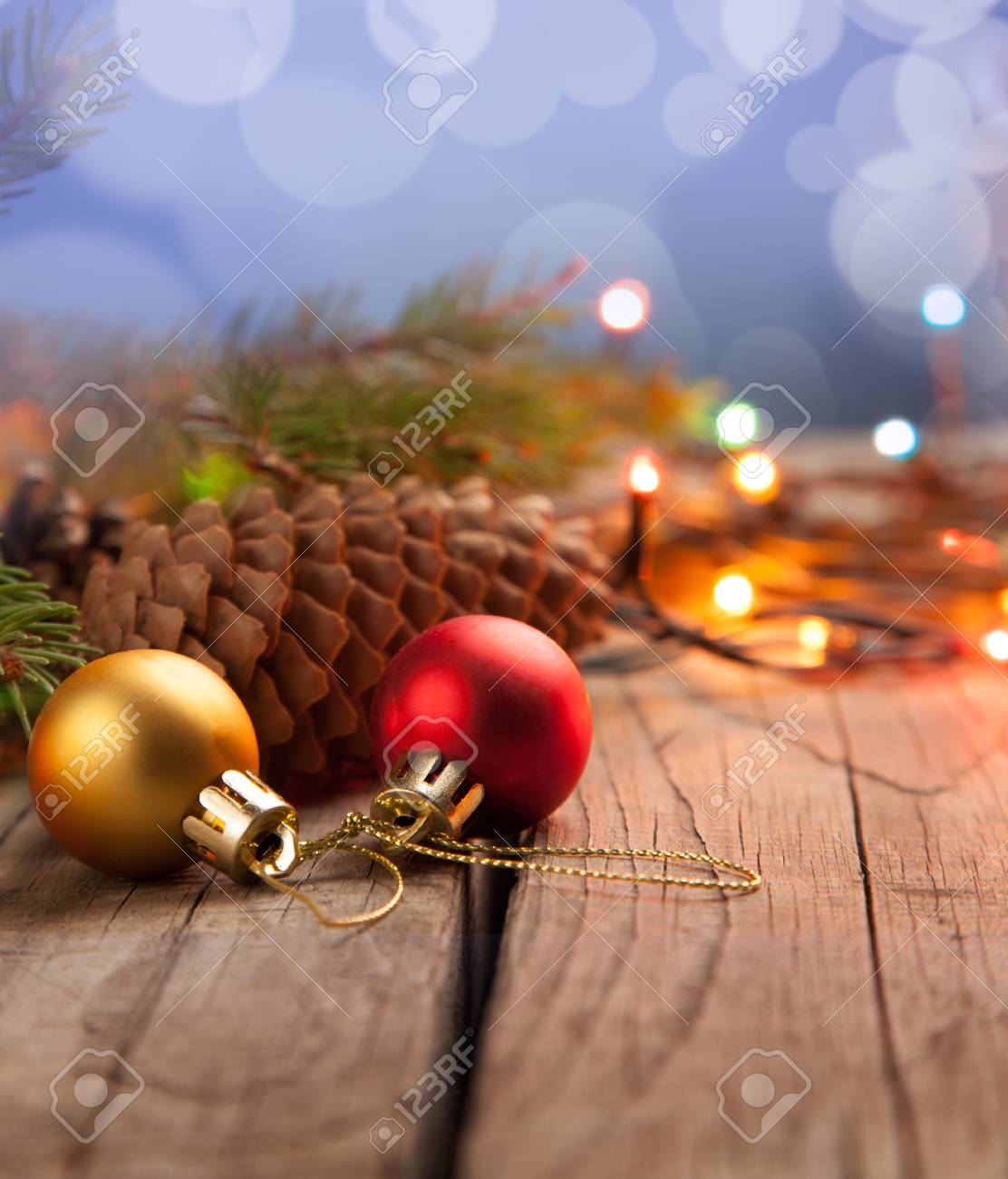 christmas ornaments on a table in the snow with a nice festive