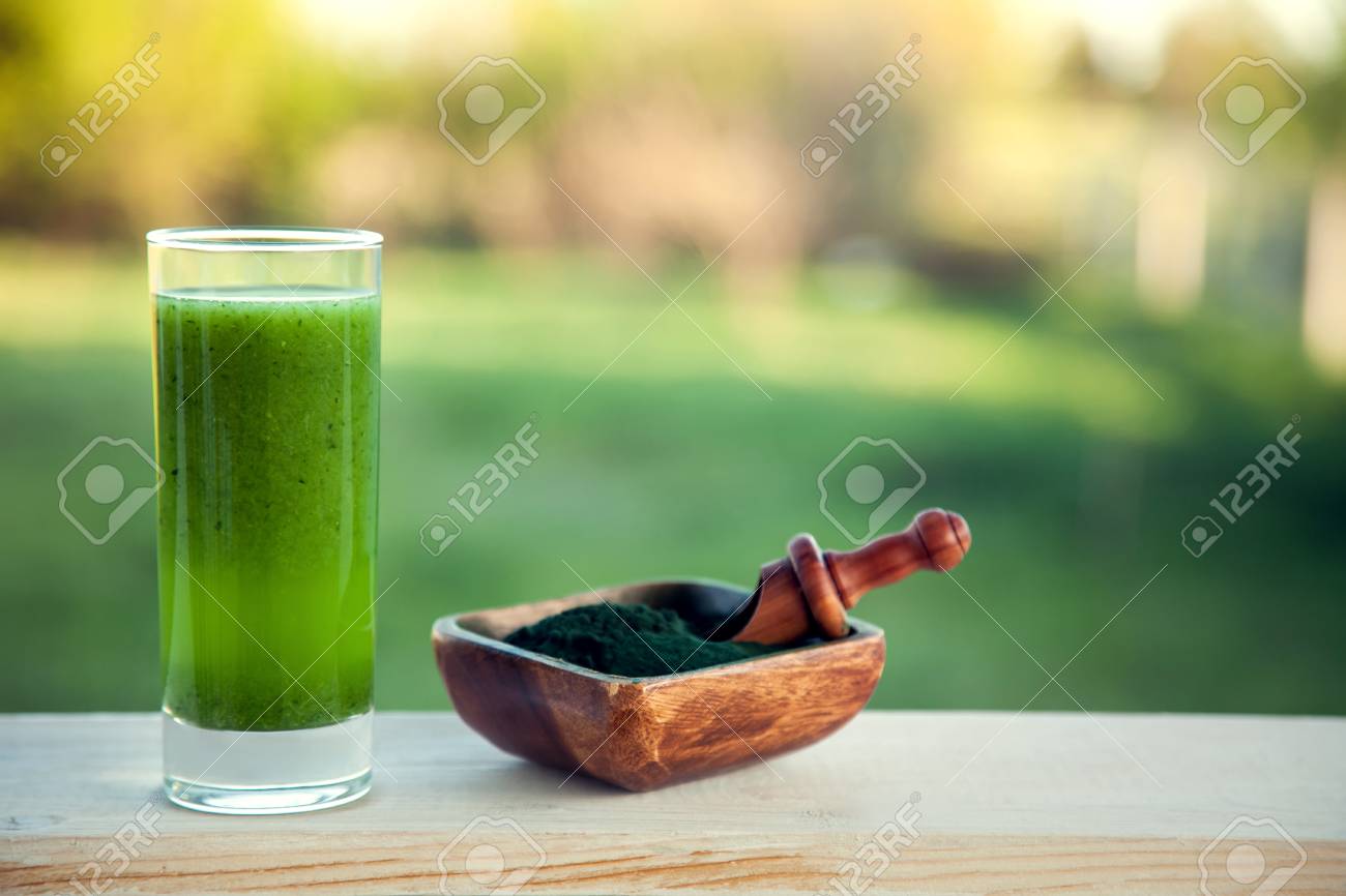 Green smoothie with spirulina on wood background - 96400228 Green smoothie with spirulina on wood background - 96400228
