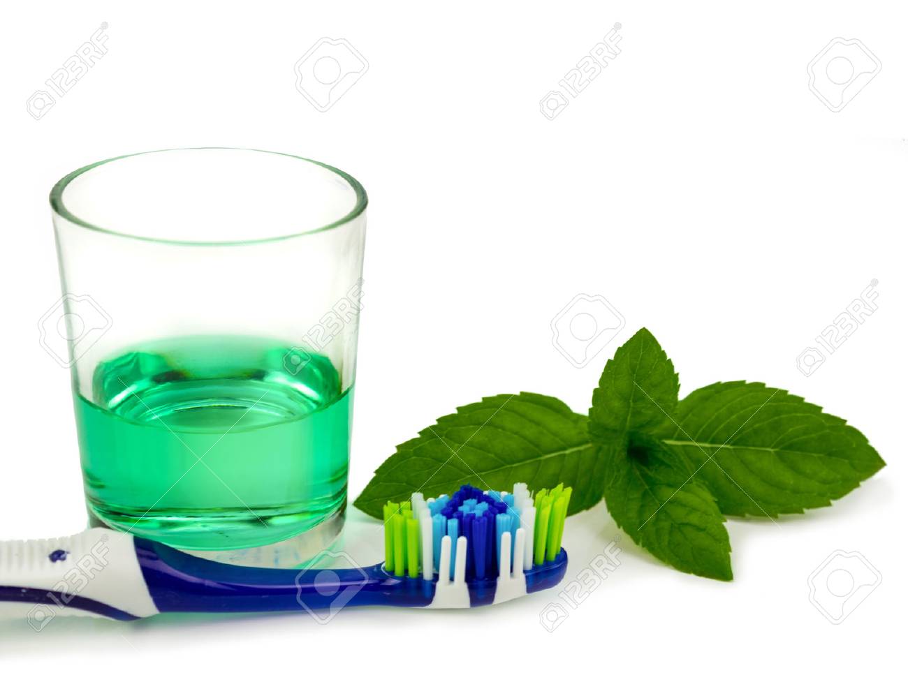 Toothbrush and mouthwash isolated over white - 71338384 Toothbrush and mouthwash isolated over white - 71338384