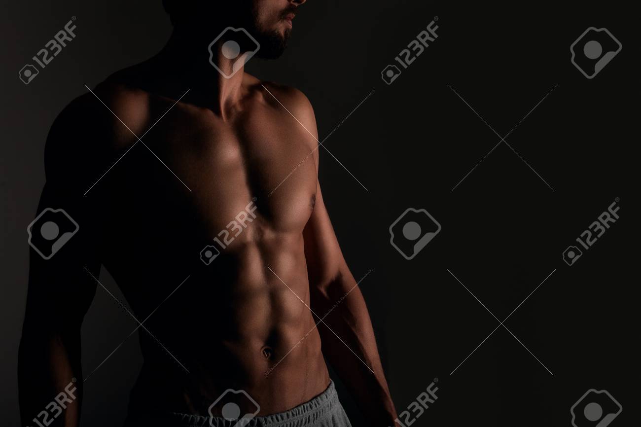 Handsome Muscular Man With Six Pack Posing On Black Background Stock Photo,  Picture and Royalty Free Image. Image 73214907., image size:1300x866