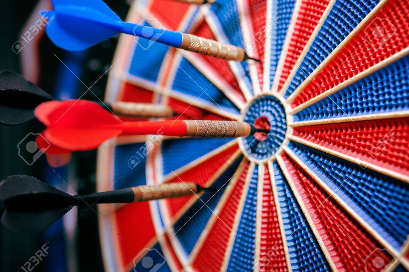 darts in bullseye in dartboard close up of darts on the board stock