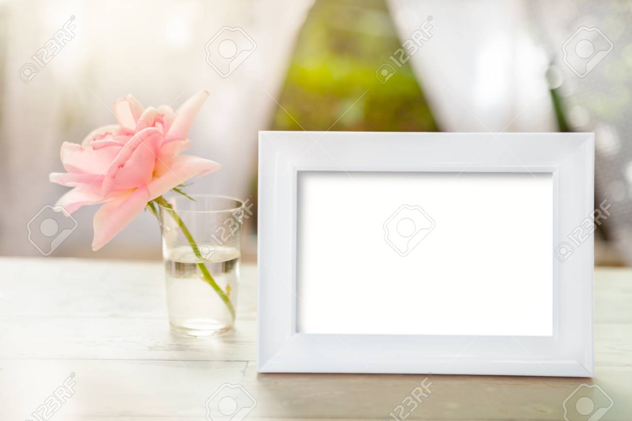 Download White Frame Mockup With Rose In Glass With Water On The Table Stock Photo Picture And Royalty Free Image Image 87758074