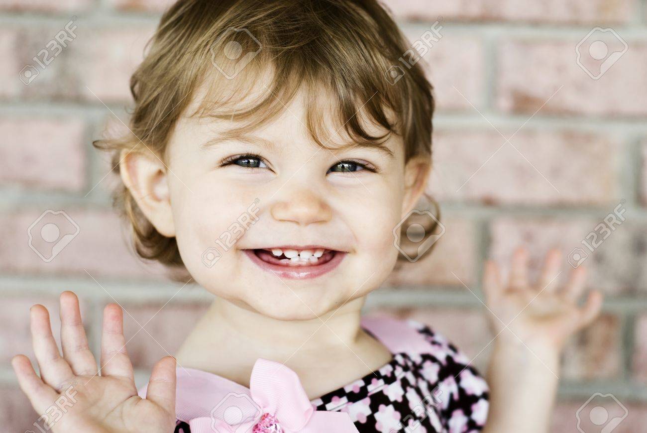 An Adorable Little Girl With Very Expressive Happy Face, Selective Focus On  Face With Blurred Background Stock Photo, Picture and Royalty Free Image.  Image 9129495.
