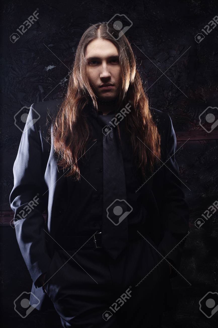 Portrait Of A Fashionable Male Model With Long Hair Over Dark Stock Photo Picture And Royalty Free Image Image Portrait Of A Fashionable Male Model With Long Hair Over Dark Stock Photo Picture And Royalty Free Image Image