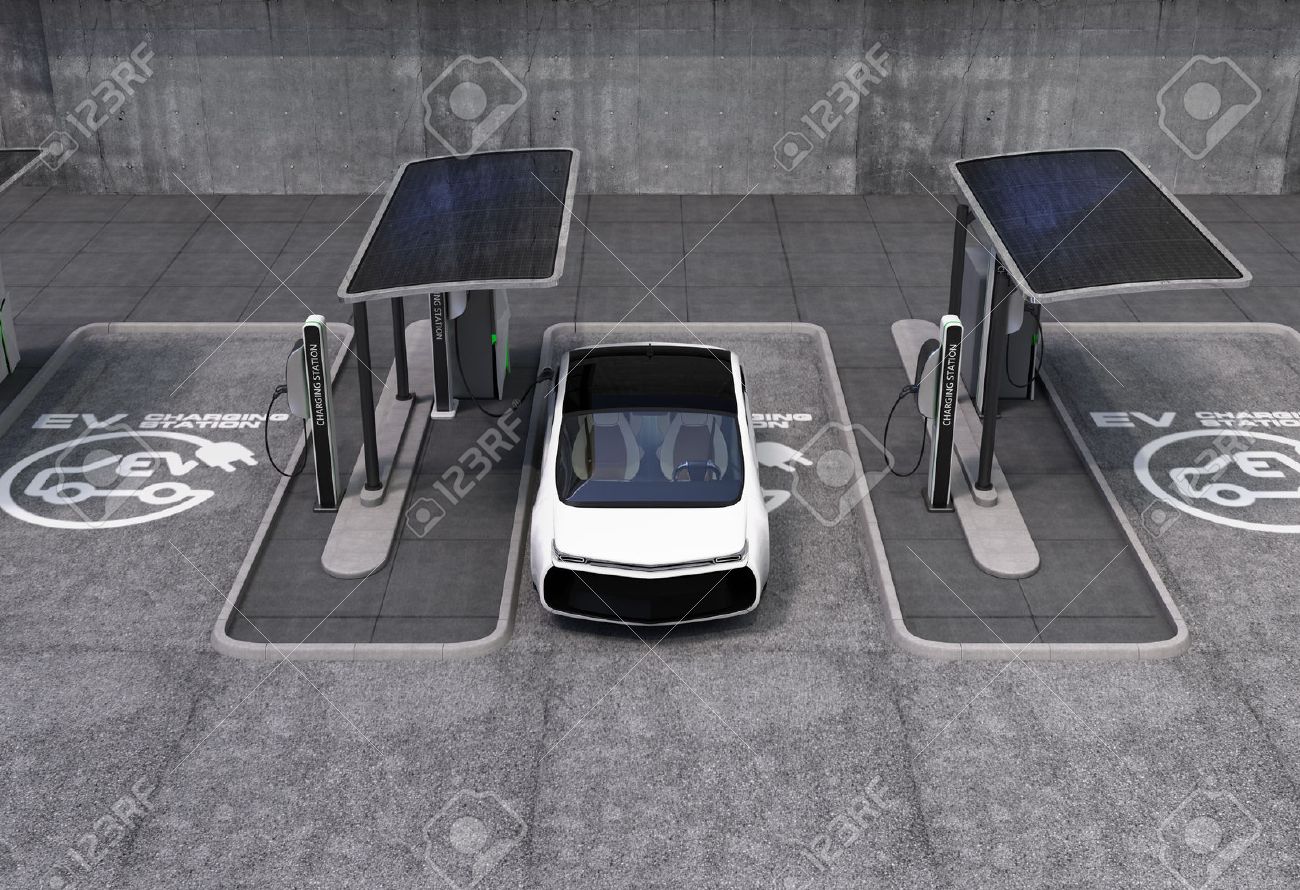 Electric vehicle charging station in public space. The charging spot support by solar panels, storage batteries. - 53666202 Electric vehicle charging station in public space. The charging spot support by solar panels, storage batteries. - 53666202