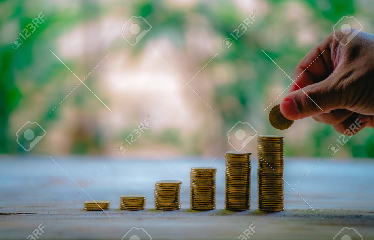 Place coins to collect coins, savings and income, or investment ideas and financial management for the future. - 122398354 Place coins to collect coins, savings and income, or investment ideas and financial management for the future. - 122398354