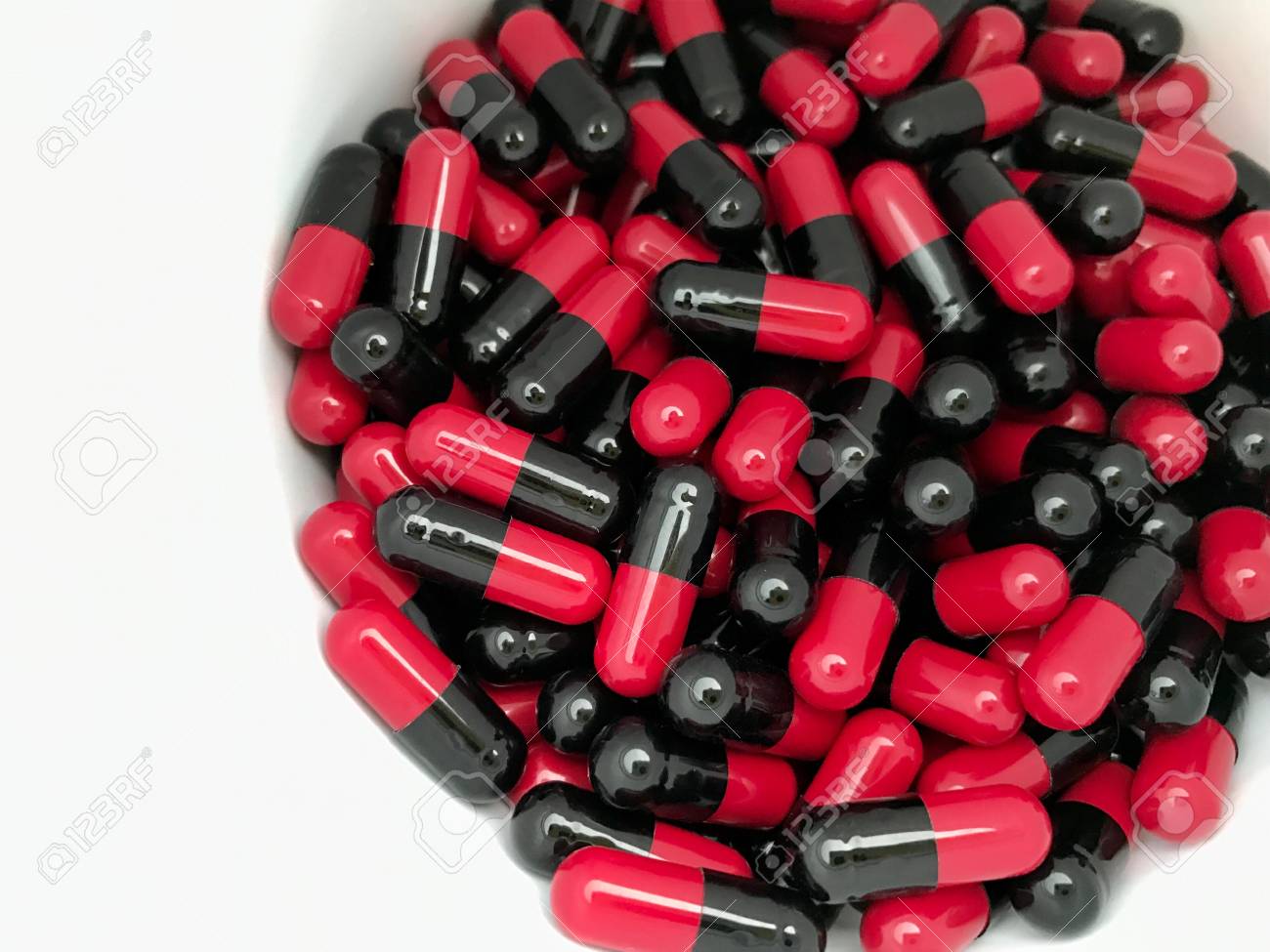 Red And Black Capsules In The Bottle Stock Photo Picture And Royalty Free Image Image 76229983