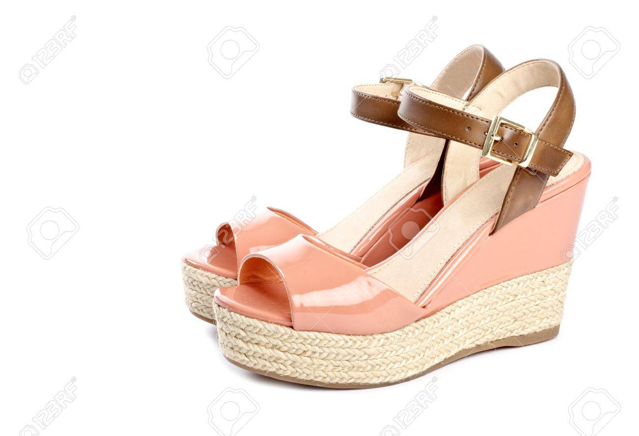 peach colored wedge sandals isolated on white stock photo picture