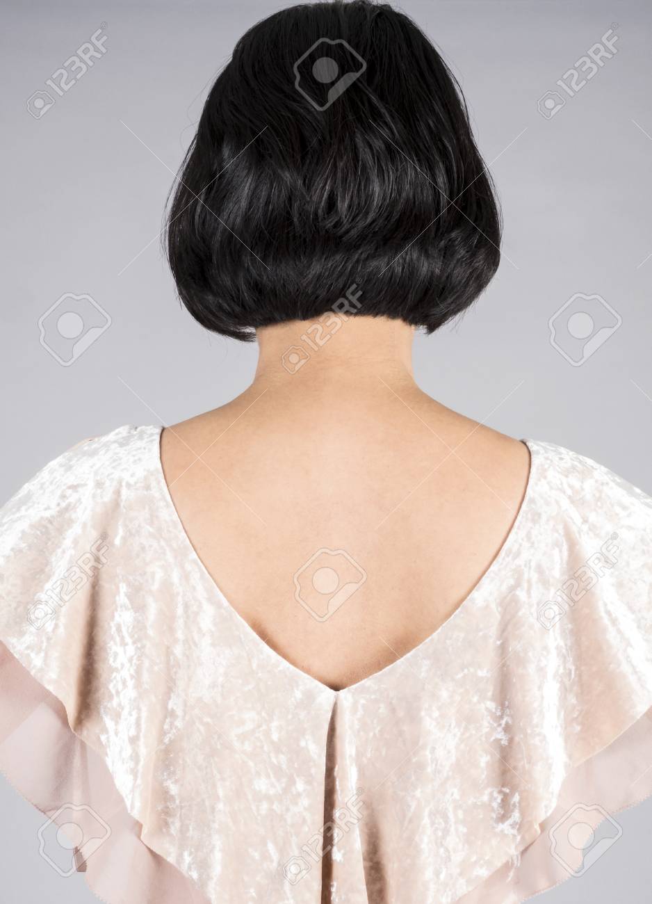 Back View Of A Woman With Shiny Short Black Hair