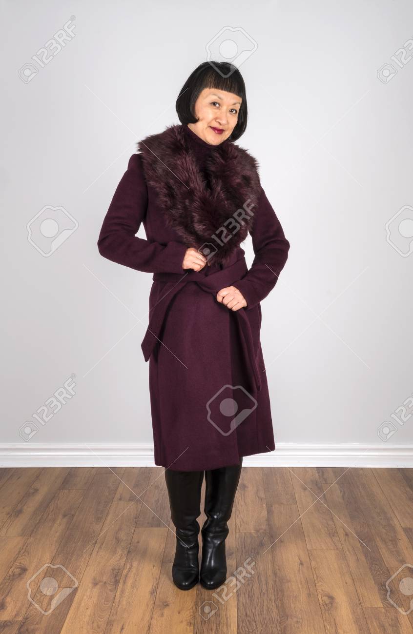 Asian Woman With Short Black Hair Wearing A Burgundy Colored