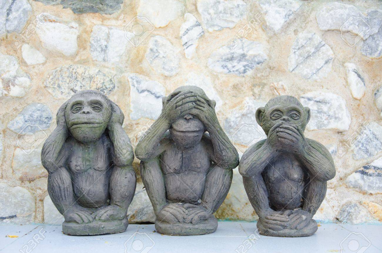 Three Wise Monkeys With Stone Background Stock Photo Picture And