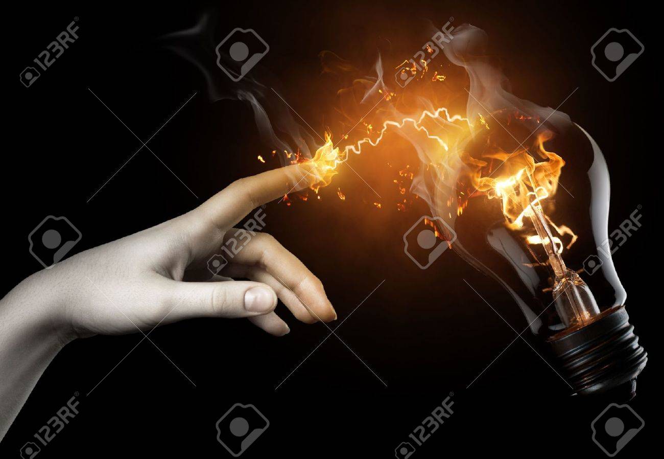 a woman pointing to the illuminated bulb - 6737066 a woman pointing to the illuminated bulb - 6737066