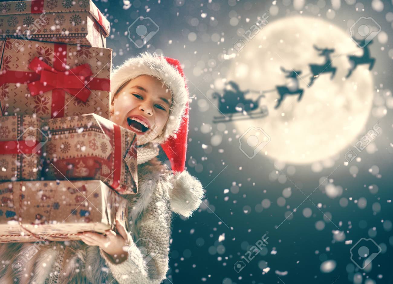 Merry Christmas Cute Little Child With Xmas Present Santa Claus Stock Photo Picture And Royalty Free Image Image 90521478