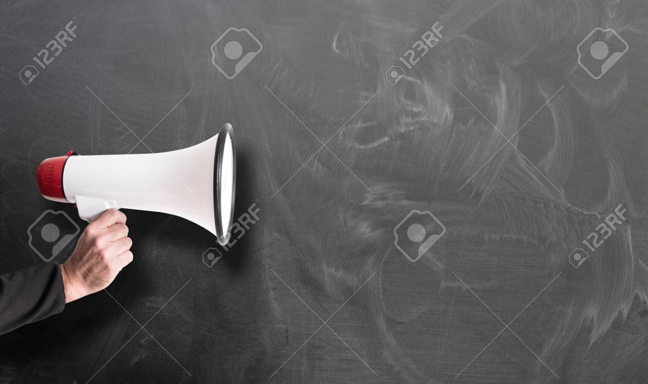 hand holding red and white megaphone against chalkboard template - 123379579 hand holding red and white megaphone against chalkboard template - 123379579