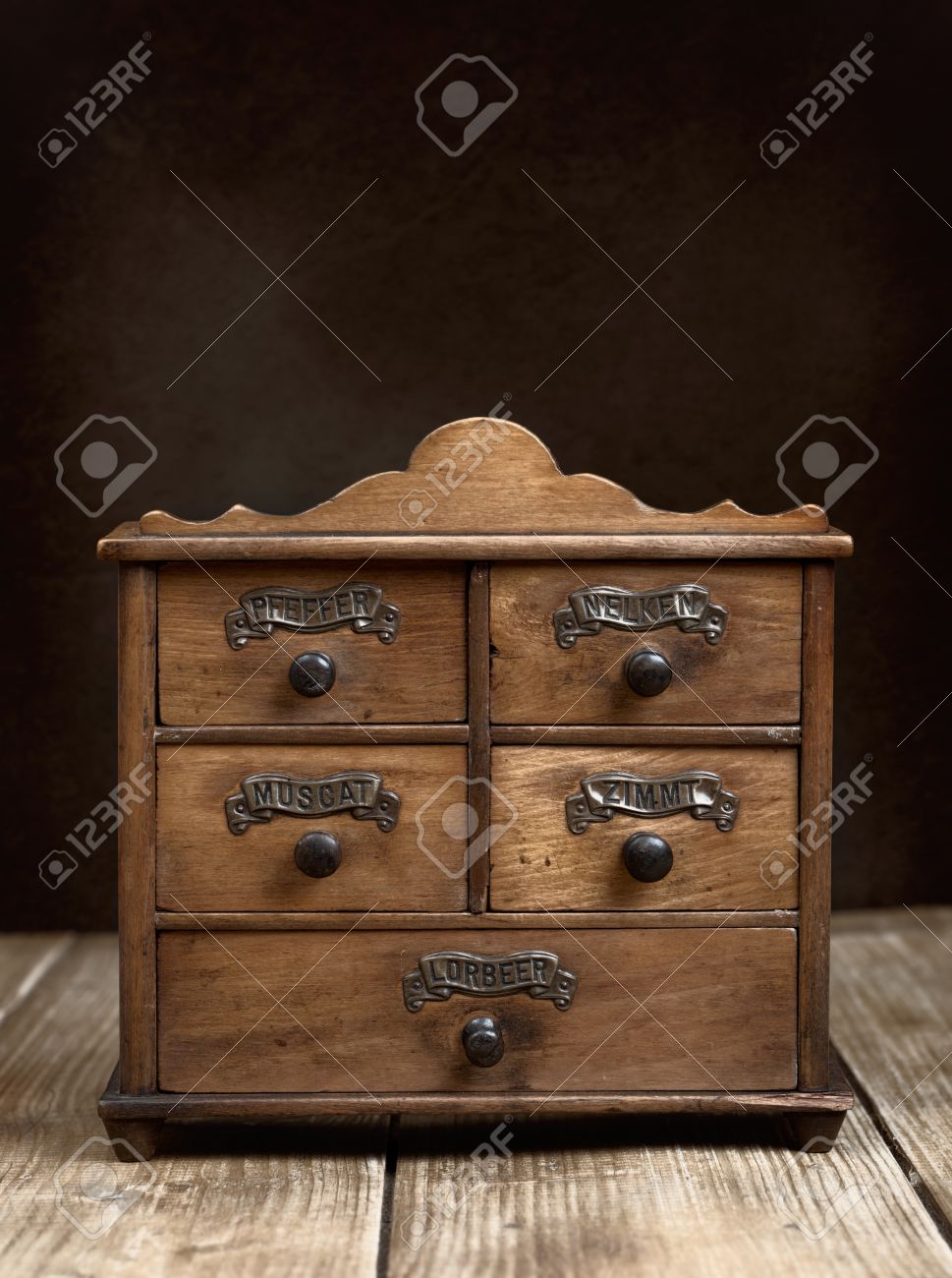 Vintage Spice Cabinet On Rustic Wooden Table