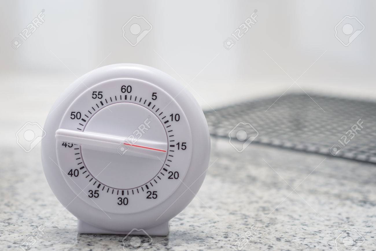 kitchen timer set for 15 minutes with cooling rack in the background