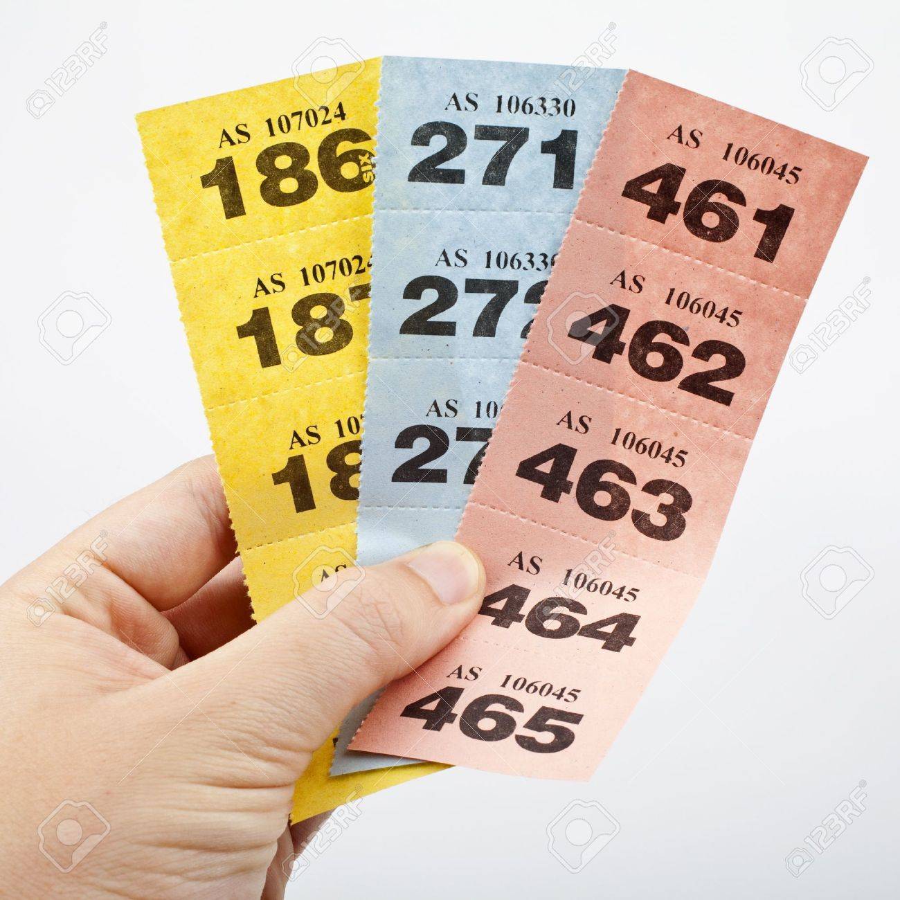 hand holding three strips of raffle tickets stock photo picture and
