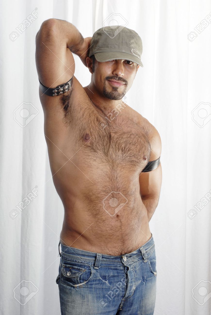 40344599-This-image-shows-a-muscular-Hispanic-man-with-trimmed-chest-hair-in-a-sexualized-pose--Stock-Photo.jpg