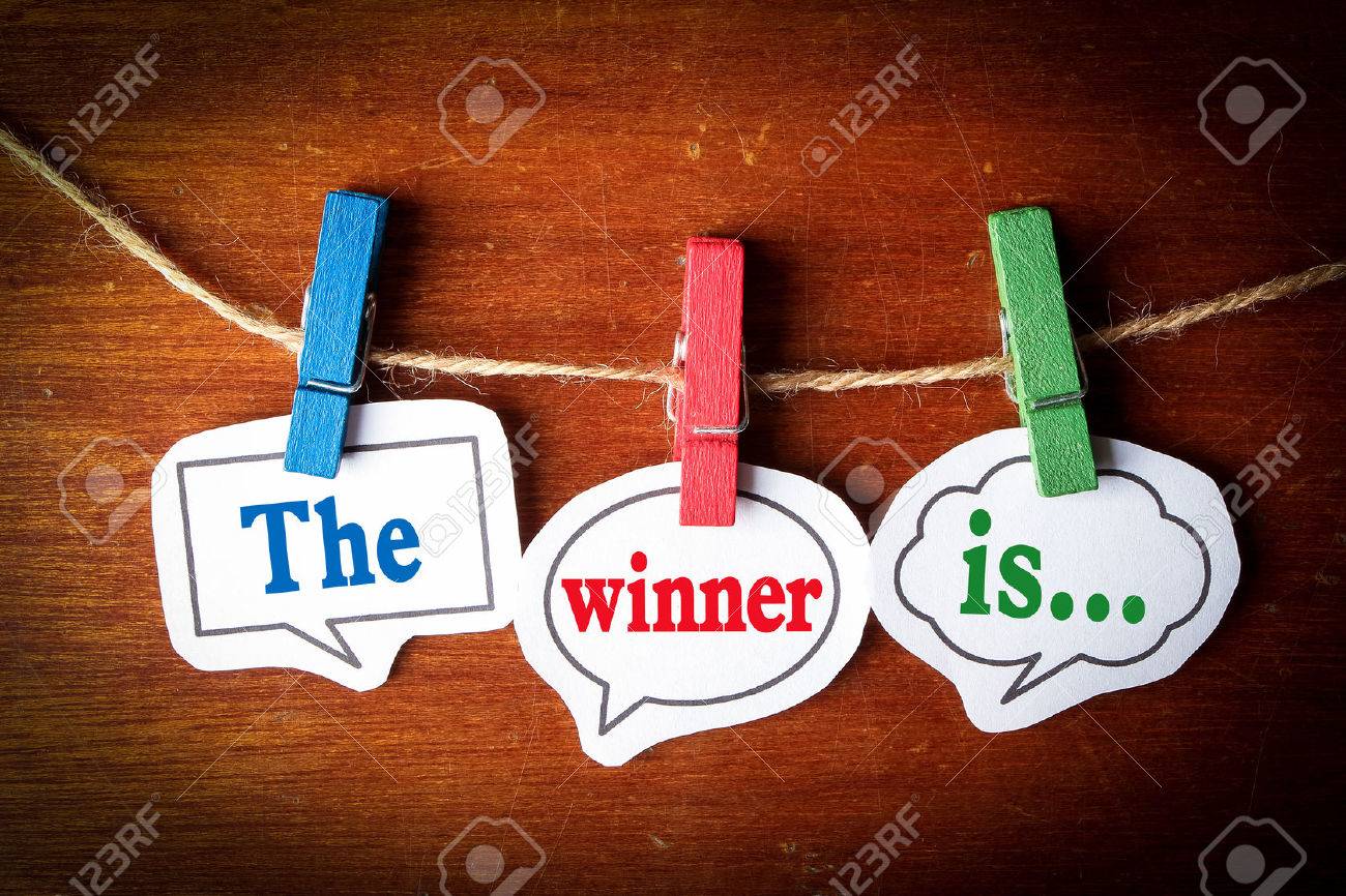 The winner is concept paper speech bubbles with line on the wooden background. - 44378377 The winner is concept paper speech bubbles with line on the wooden background. - 44378377