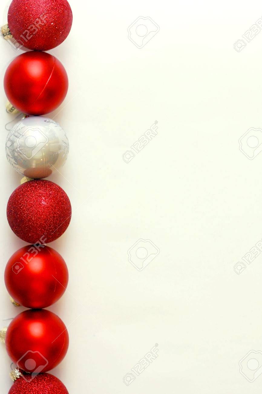a row of red and silver sparkly christmas ornaments are lined