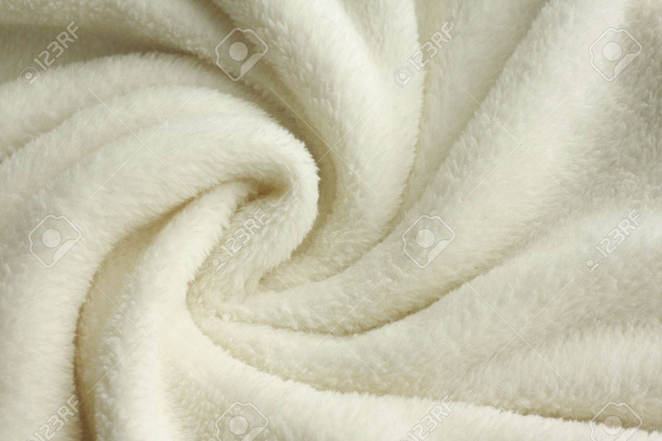a warm, white, plush micro fleece blanket is swirled into a cirular pattern background - 26105629 a warm, white, plush micro fleece blanket is swirled into a cirular pattern background - 26105629