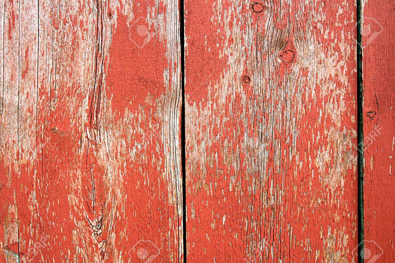 Red Barn Wood a background of old red barnwood with peeling paint on the Red Barn Wood a background of old red barnwood with peeling paint on the