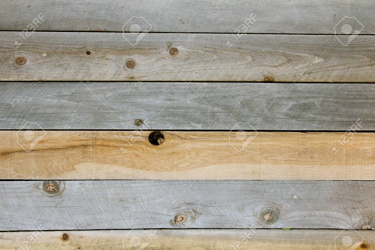 A Background Of Textured Rustic Wooden Plank Boards That Are Knotted And Weathered Grey Tan A Background Of Textured Rustic Wooden Plank Boards That Are Knotted And Weathered Grey Tan