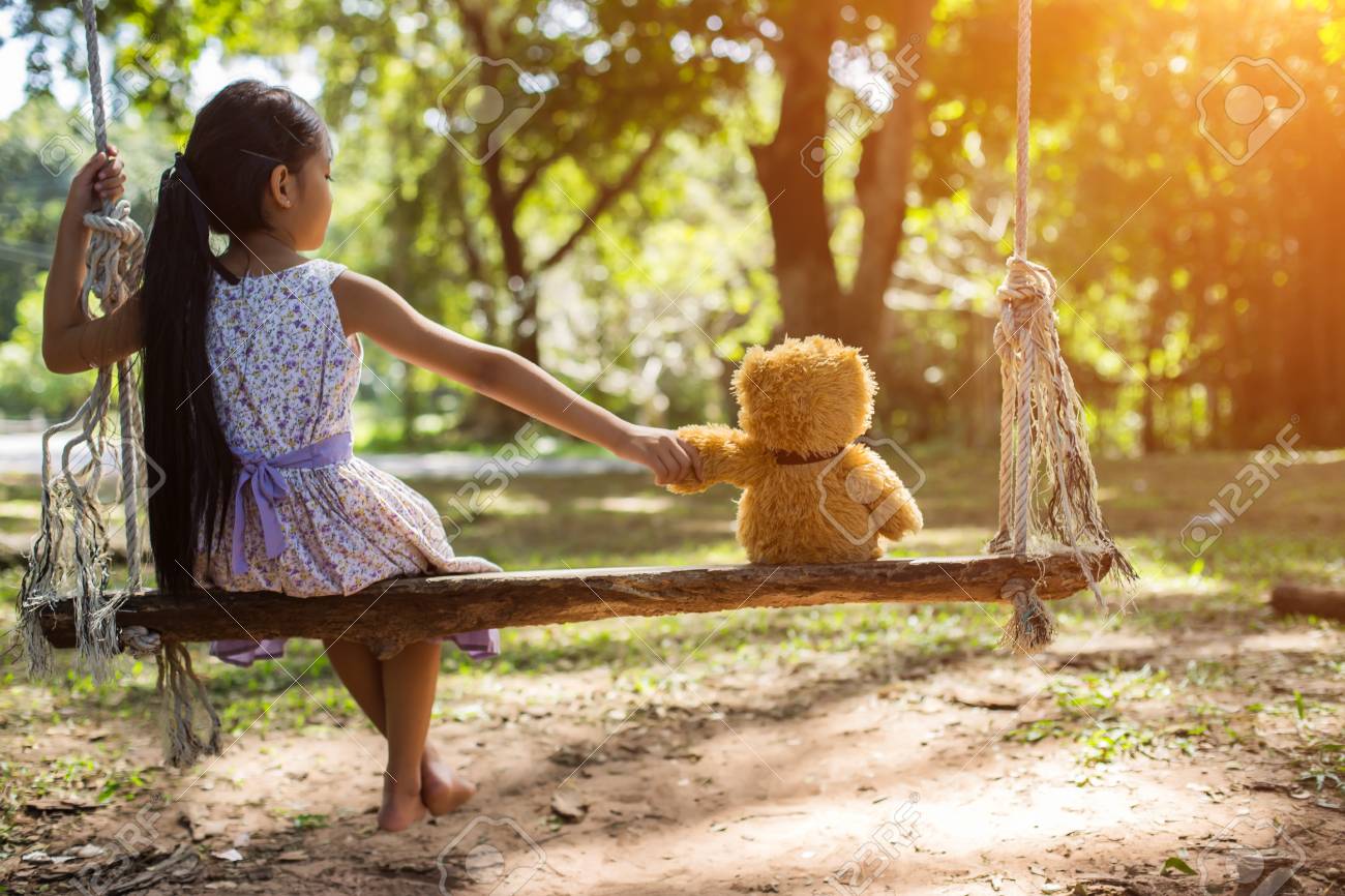 girl and teddy bear
