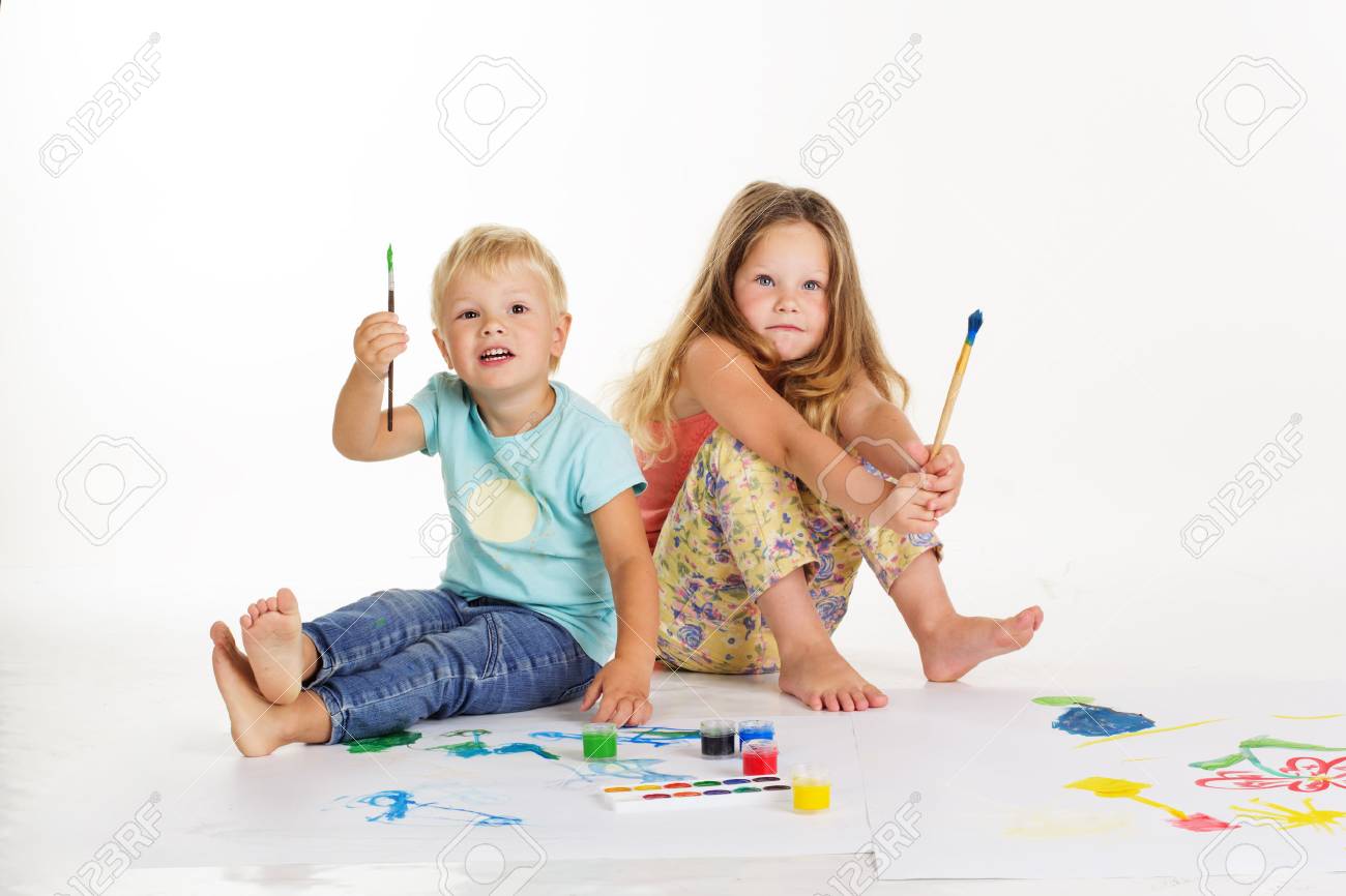 Two Pretty Child Friends Boy And Girl Are Drawing Pictures By Stock Photo Picture And Royalty Free Image Image