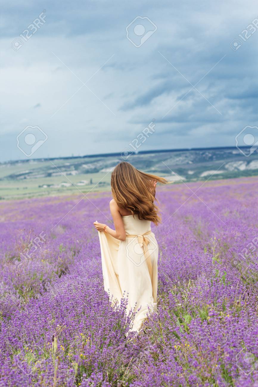 Beautiful Smiling Woman Is Wearing Wedding Dress Running At Field Stock Photo Picture And Royalty Free Image Image