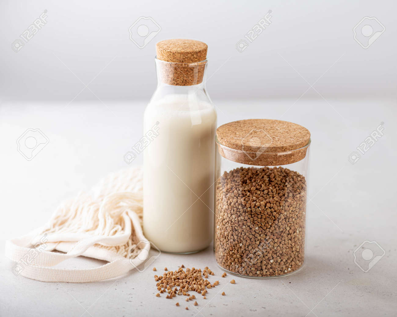 buckwheat and buckwheat milk on a white background, gluten-free concept - 169788422 buckwheat and buckwheat milk on a white background, gluten-free concept - 169788422