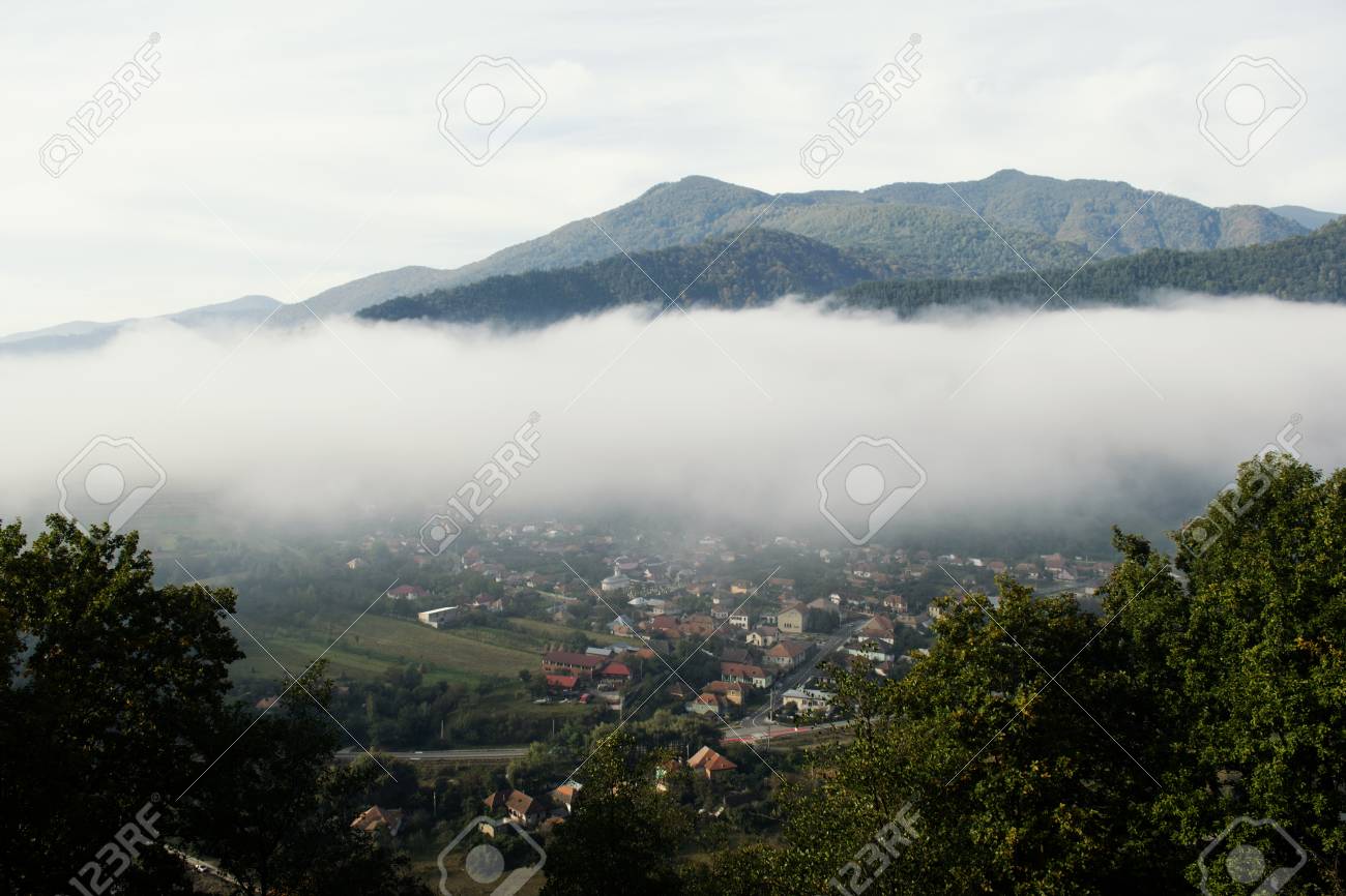 mountain village fog panorama