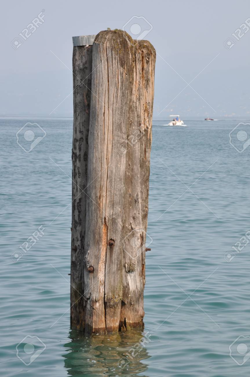 Wooden Pole In The Water Stock Photo, Picture and Royalty Free Image. Image  21161787.