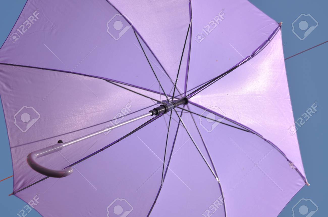 Stock P O Ed Umbrella Against Blue Sky View From Below Stock P O Ed Umbrella Against Blue Sky View From Below
