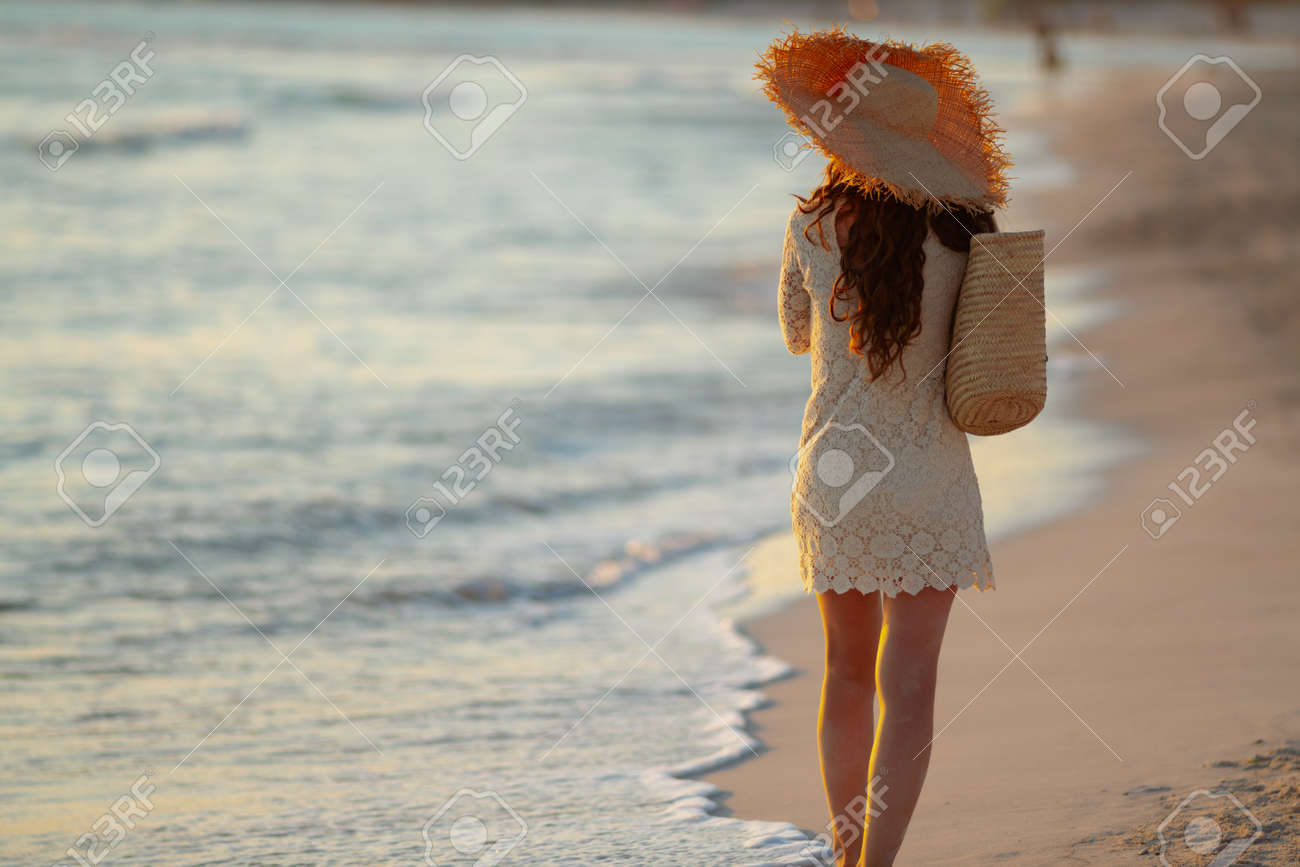 white dress by the shore