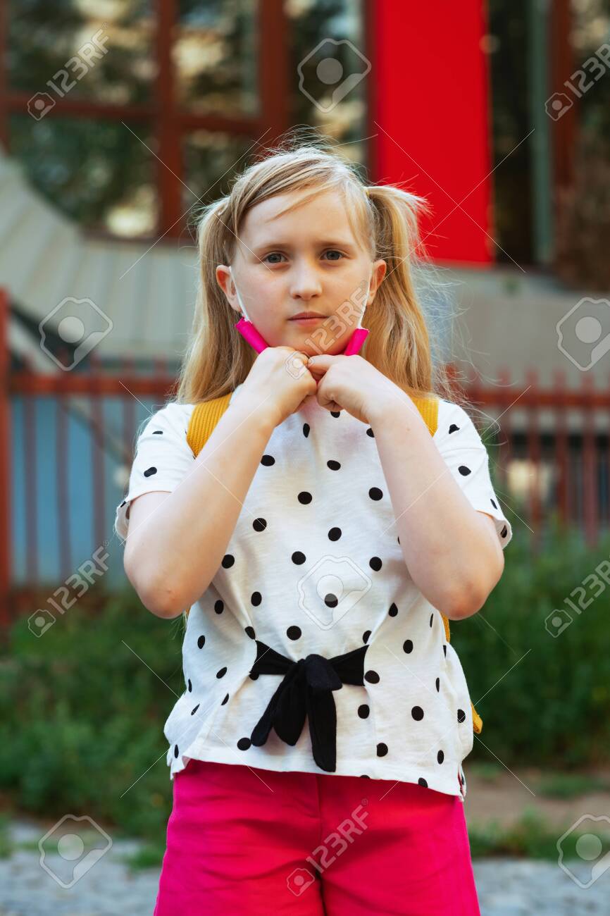 yellow and white polka dot blouse