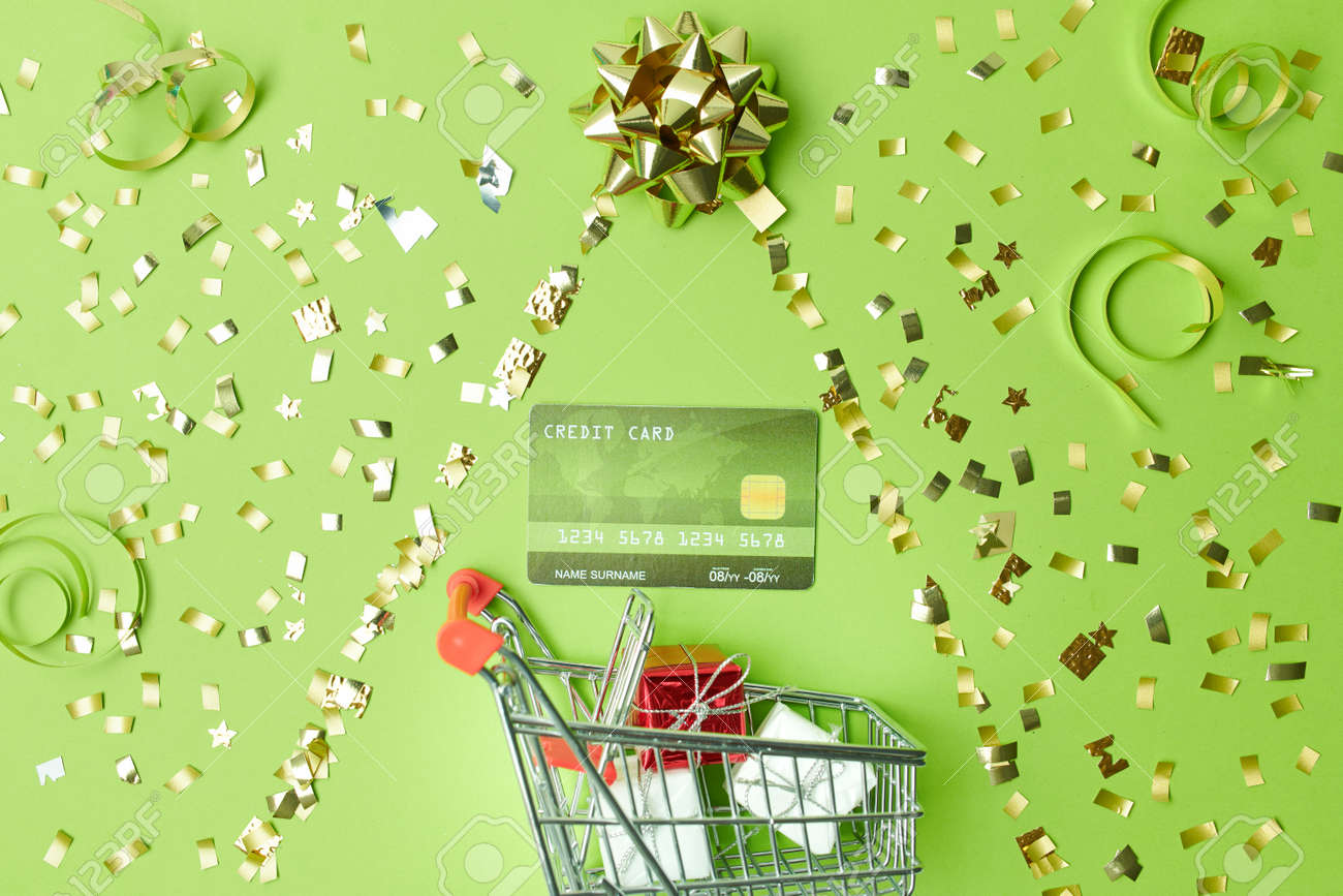 Merry Christmas. flat lay with dustpan and cleaning brush on green background. - 158517988 Merry Christmas. flat lay with dustpan and cleaning brush on green background. - 158517988